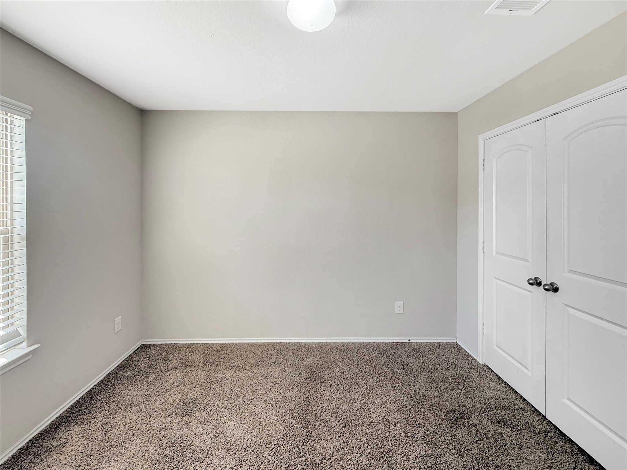 15443 Cipres Verde Street Channelview, TX 77530 - Photo 21 of 27 a view of an empty room and window