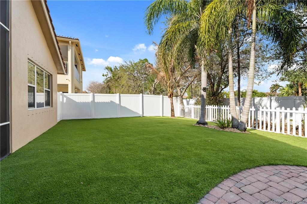 2973 Southwest Porpoise Circle Stuart, FL 34997 - Photo 14 of 47 a view of a house with a yard