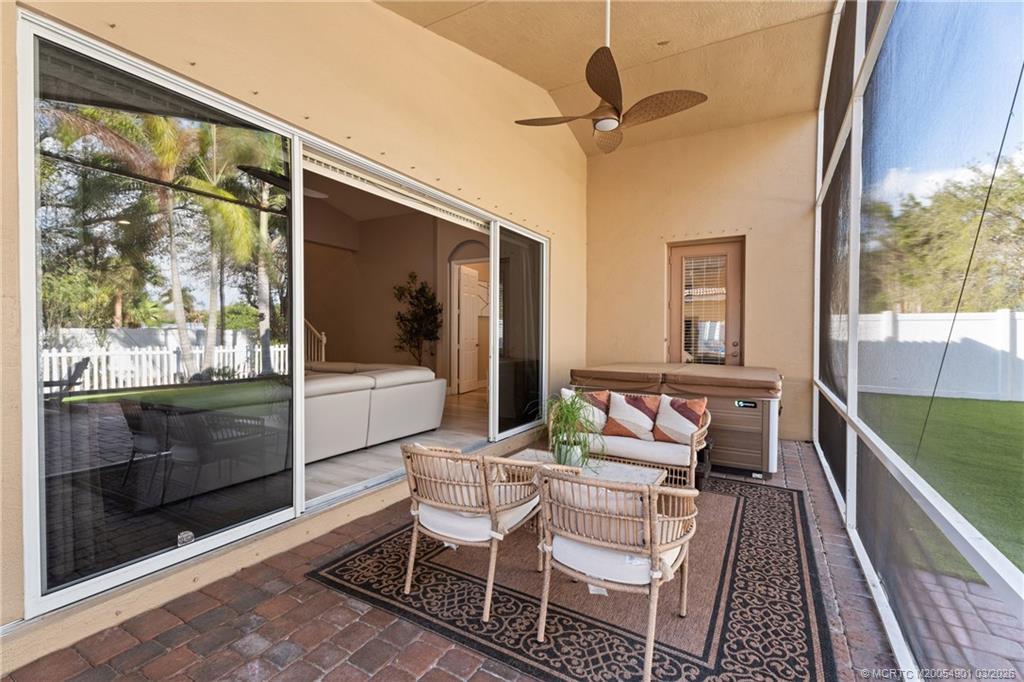 2973 Southwest Porpoise Circle Stuart, FL 34997 - Photo 17 of 47 a dining room with wooden floor and a rug