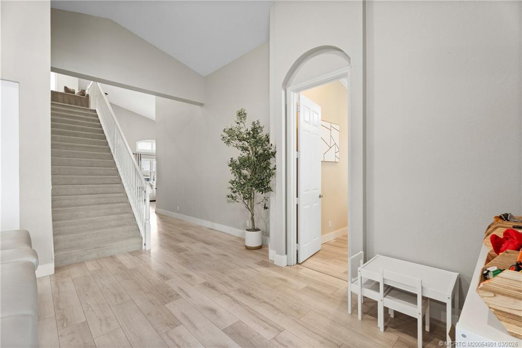 2973 Southwest Porpoise Circle Stuart, FL 34997 - Photo 30 of 47 a view of a hallway with wooden floor and entryway