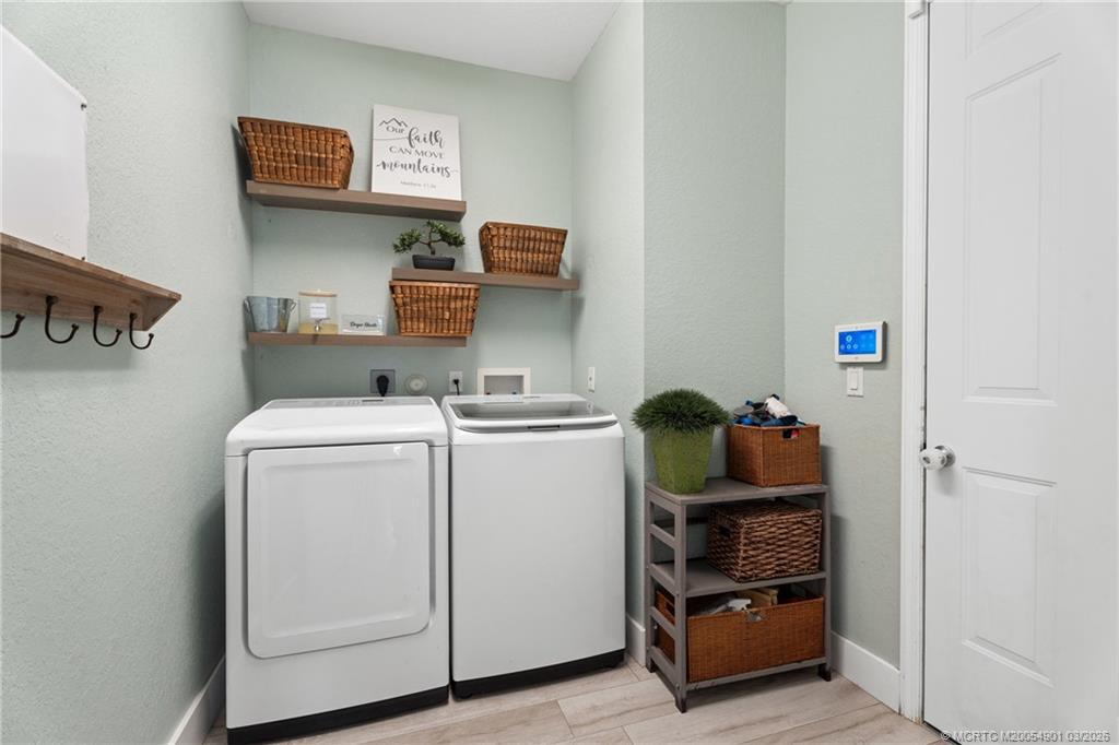 2973 Southwest Porpoise Circle Stuart, FL 34997 - Photo 40 of 47 a utility room with dryer and washer