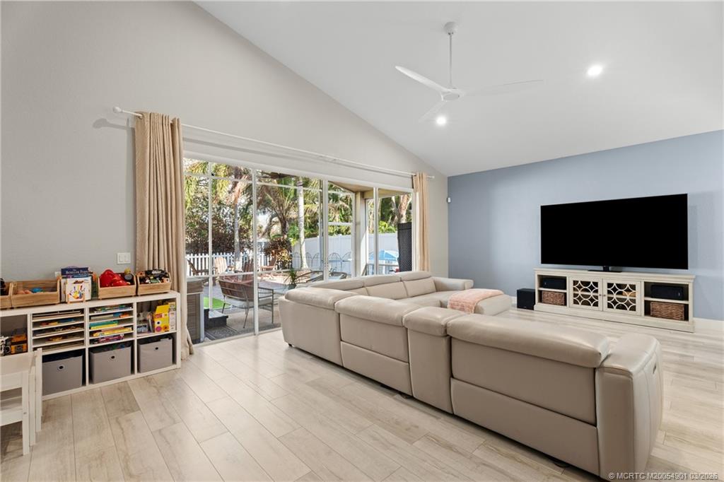 2973 Southwest Porpoise Circle Stuart, FL 34997 - Photo 41 of 47 a room with furniture and flat screen tv