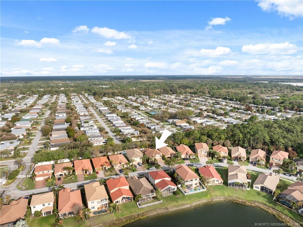 2973 Southwest Porpoise Circle Stuart, FL 34997 - Photo 44 of 47 an aerial view of residential houses with outdoor space