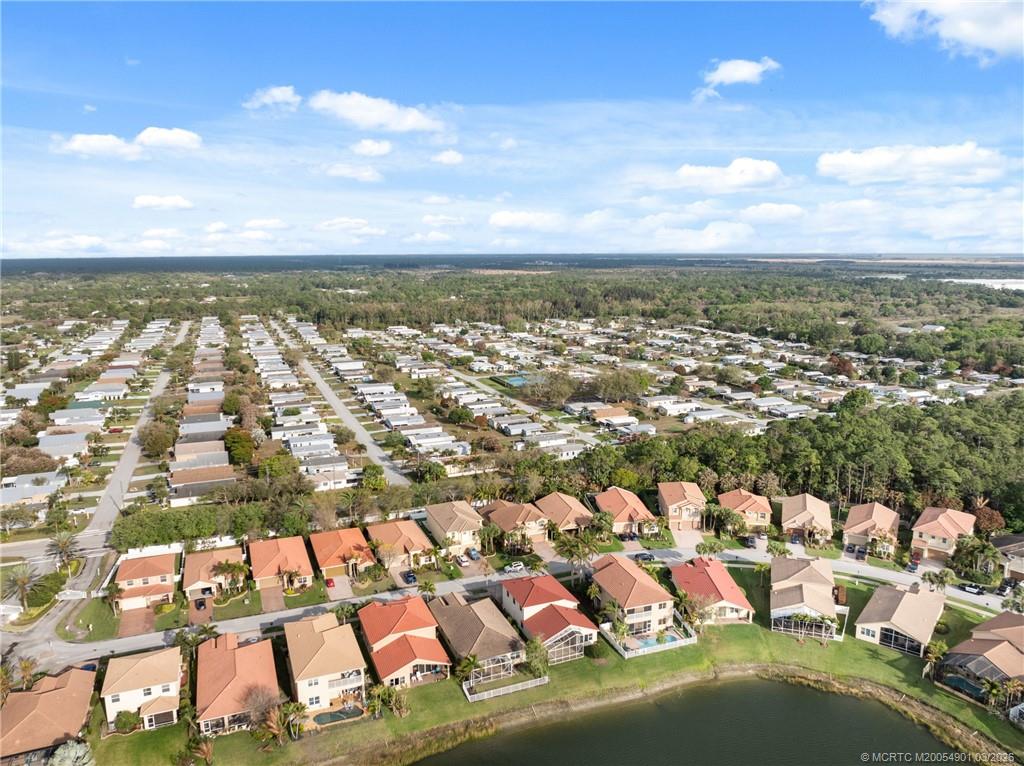 2973 Southwest Porpoise Circle Stuart, FL 34997 - Photo 45 of 47 an aerial view of residential houses with outdoor space