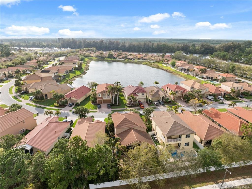 2973 Southwest Porpoise Circle Stuart, FL 34997 - Photo 46 of 47 an aerial view of residential houses with outdoor space