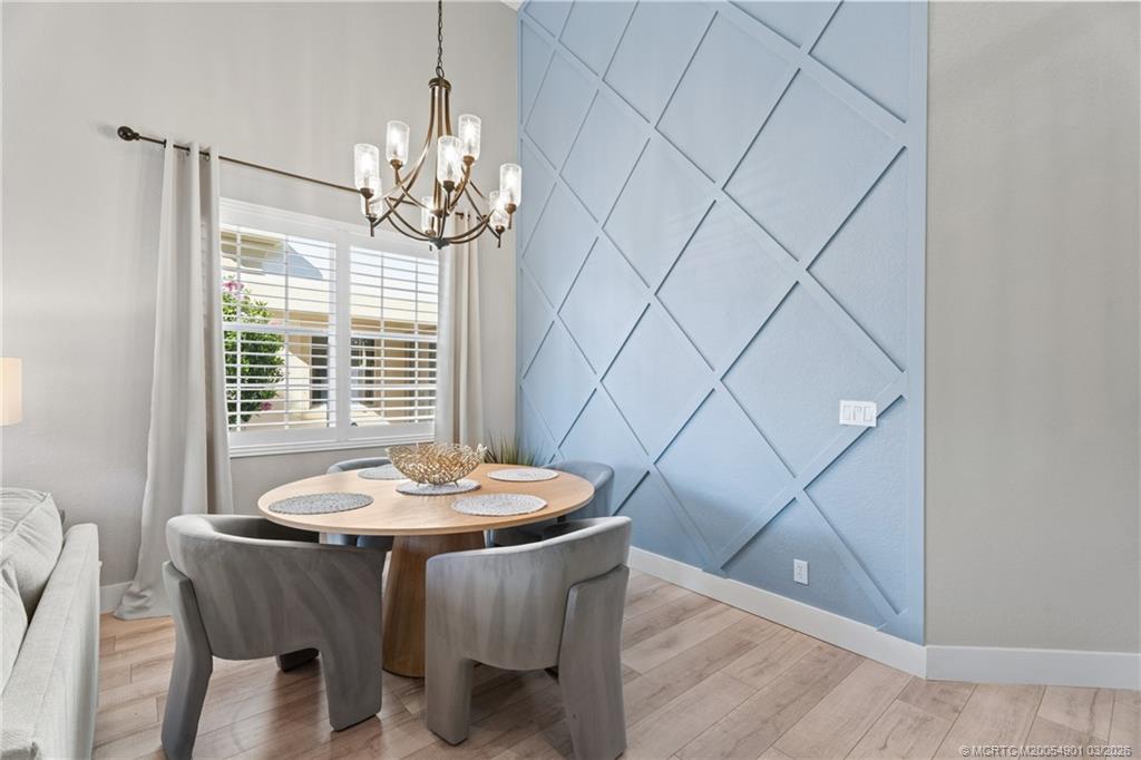 2973 Southwest Porpoise Circle Stuart, FL 34997 - Photo 5 of 47 a dining room with furniture and window