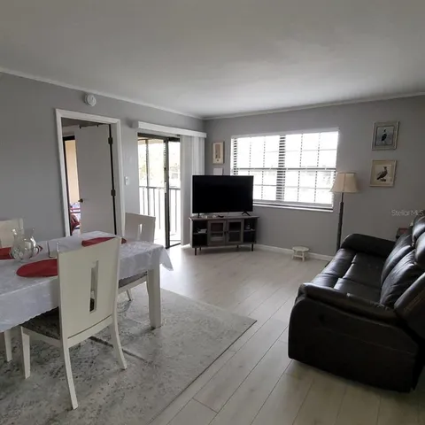 a bathroom with a sink a toilet a tub and shower