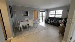 a view of a livingroom with furniture and a flat screen tv