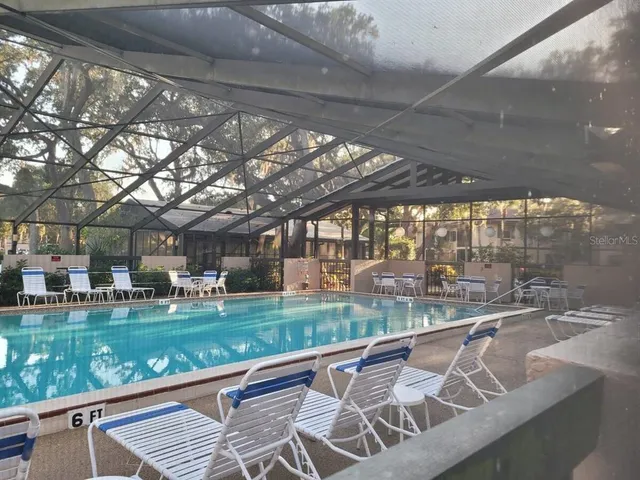 a view of swimming pool with outdoor seating