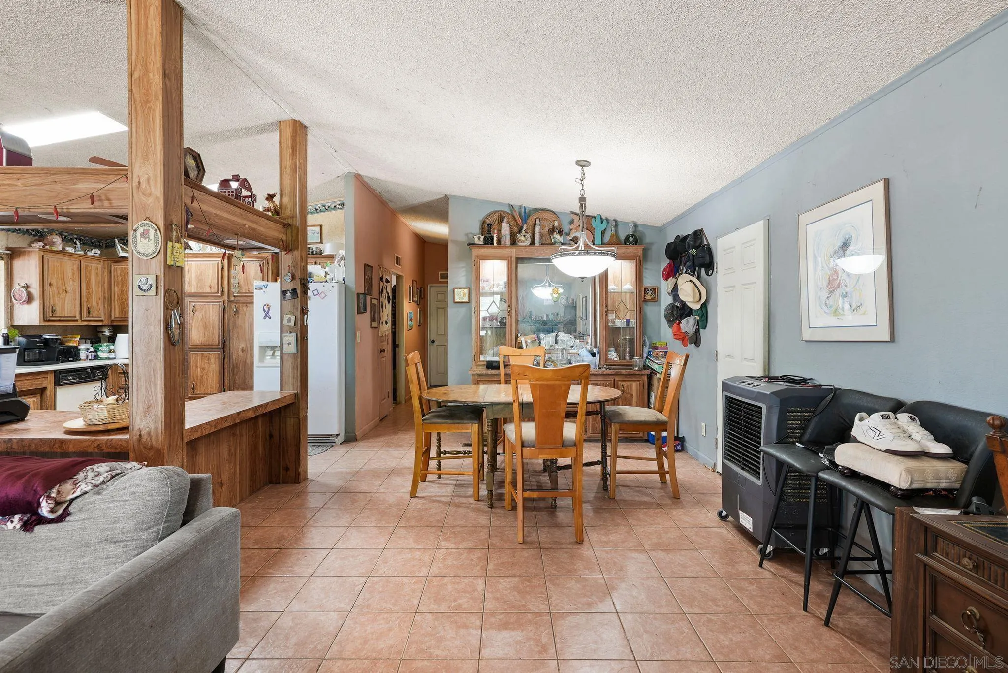 1070 Harris Ranch Road Potrero, CA 91963 - Photo 17 of 58 a dining room with furniture and a chandelier