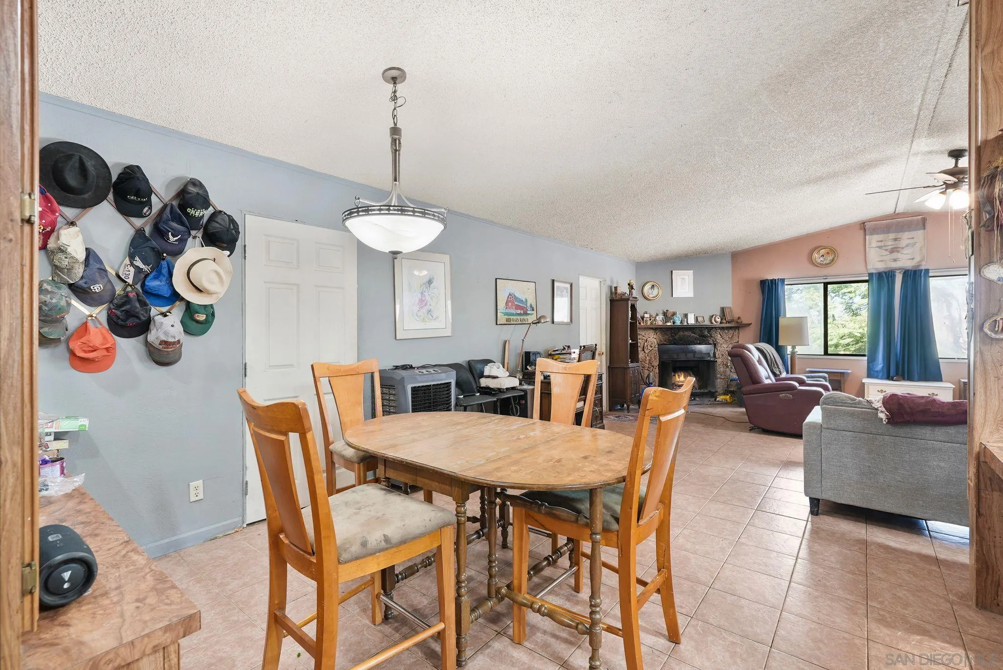 1070 Harris Ranch Road Potrero, CA 91963 - Photo 18 of 58 a view of a dining room with furniture and chandelier