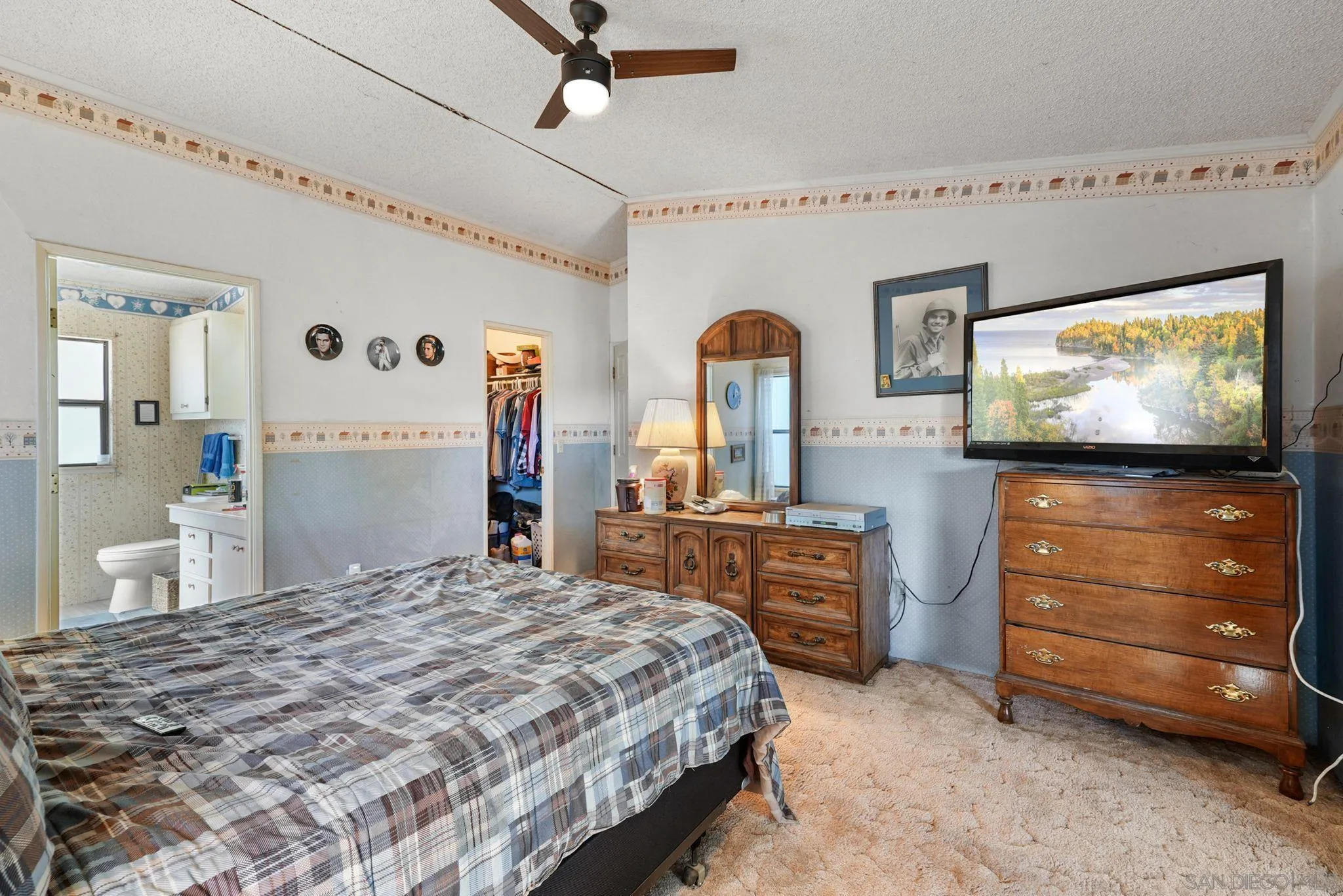 1070 Harris Ranch Road Potrero, CA 91963 - Photo 19 of 58 a bedroom with a bed and a flat screen tv