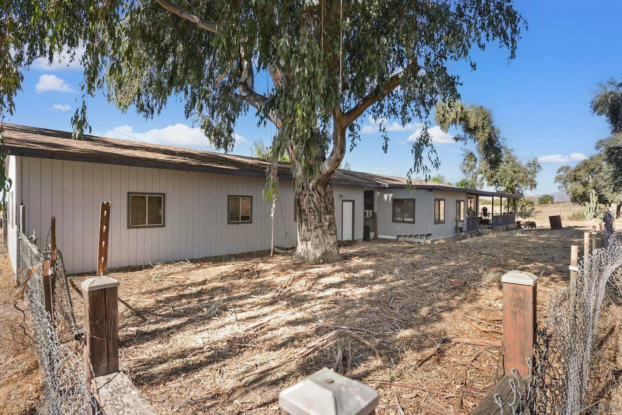 1070 Harris Ranch Road Potrero, CA 91963 - Photo 26 of 58 a backyard of a house with table and chairs