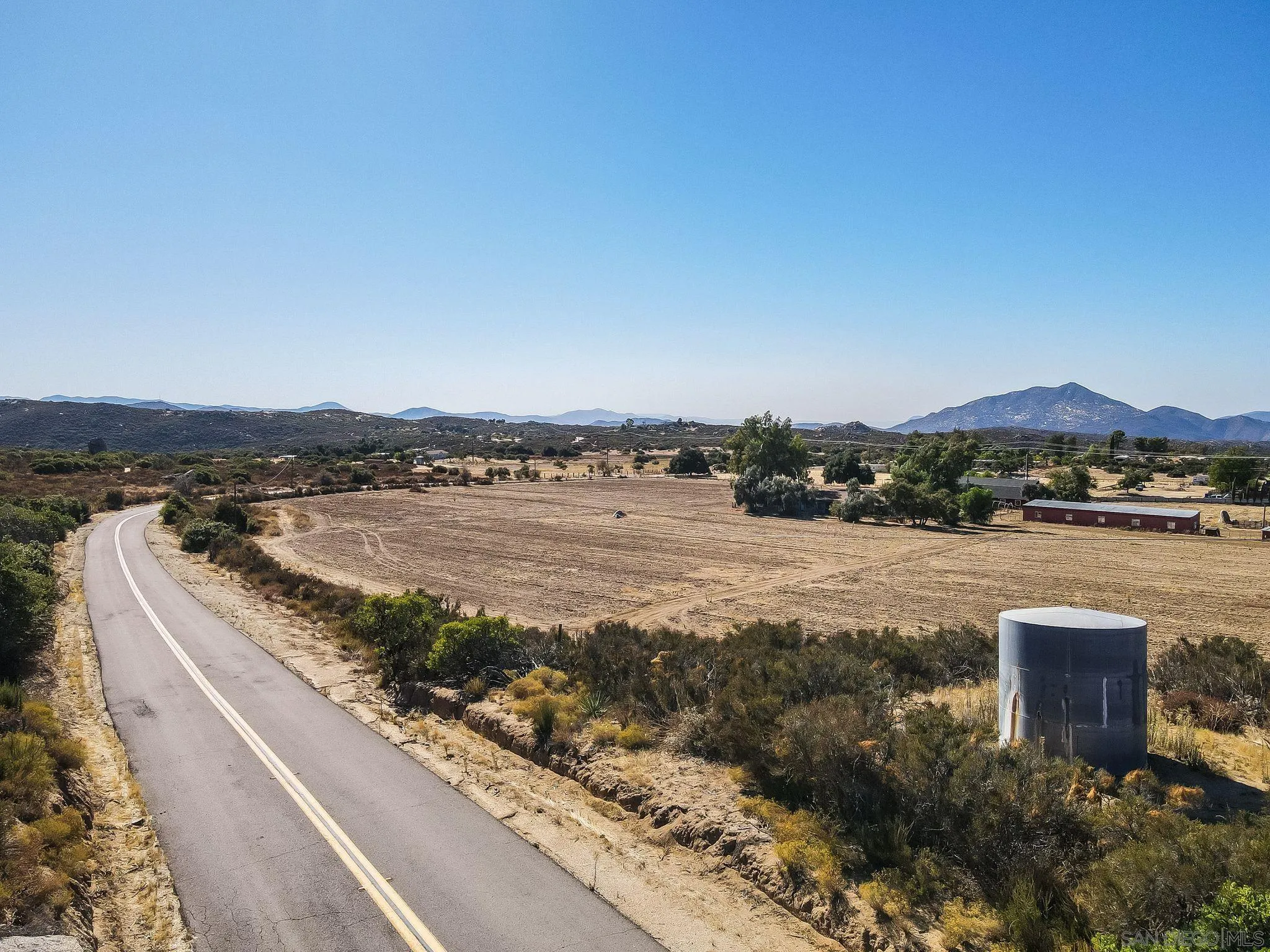 1070 Harris Ranch Road Potrero, CA 91963 - Photo 48 of 58 a view of a lake with mountains in the background