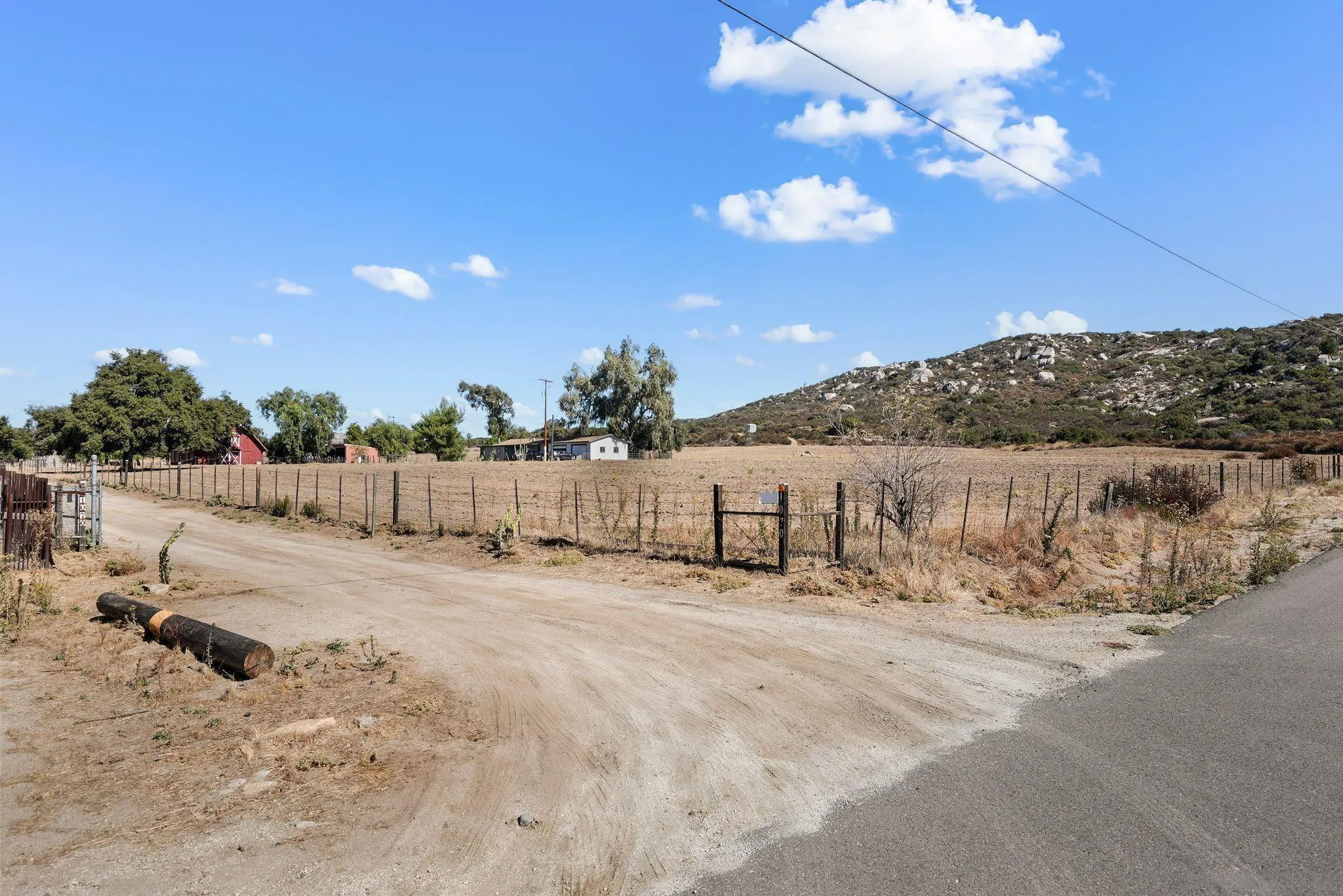 1070 Harris Ranch Road Potrero, CA 91963 - Photo 52 of 58 a view of a dry yard with a tree
