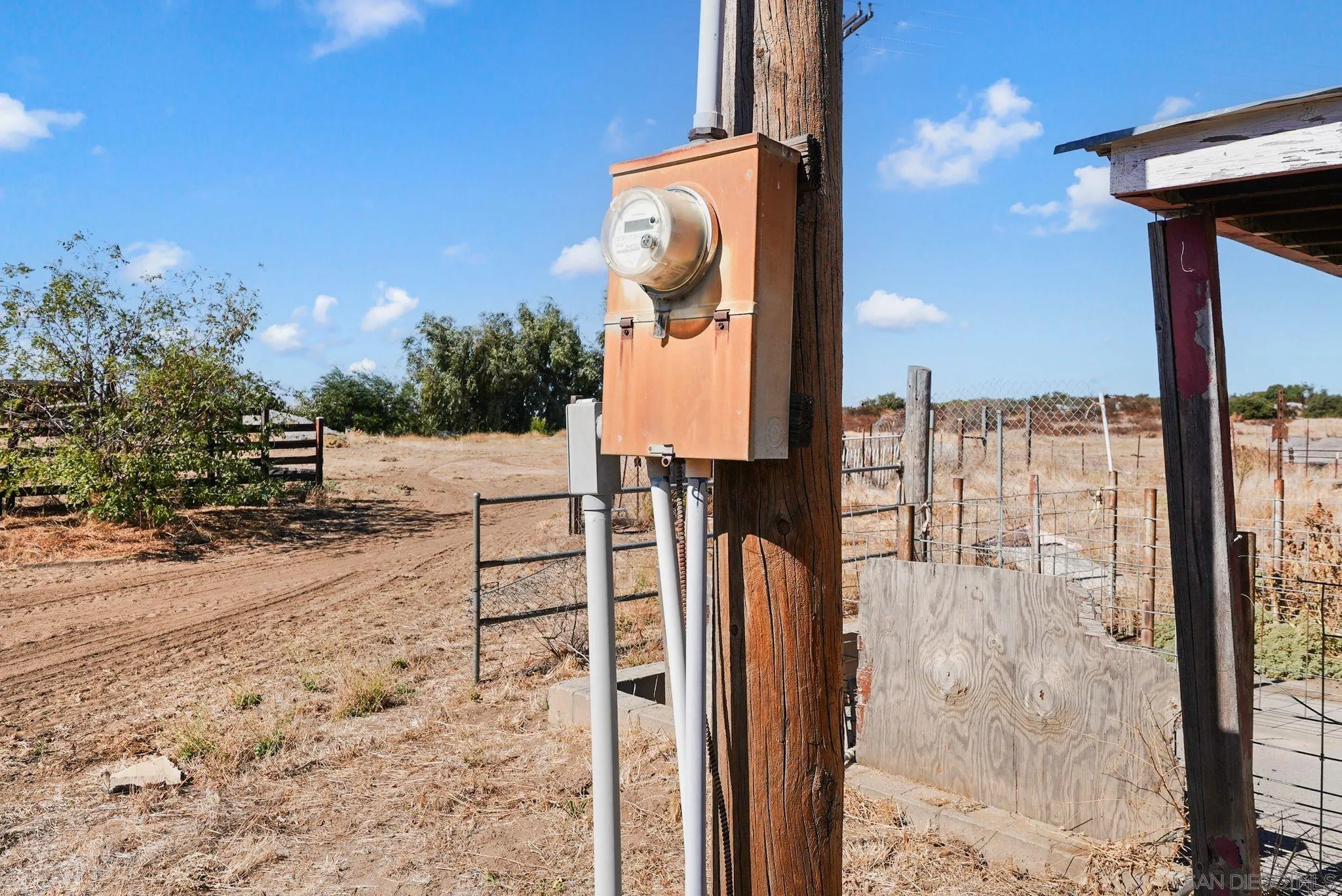 1070 Harris Ranch Road Potrero, CA 91963 - Photo 55 of 58 a street sign on a sidewalk next to a road