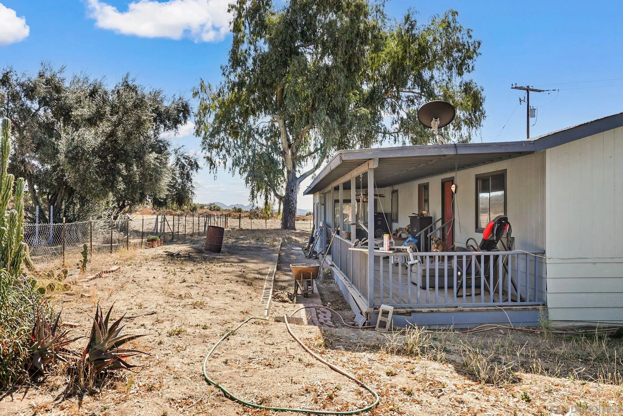 1070 Harris Ranch Road Potrero, CA 91963 - Photo 8 of 58 a view of a house with a wooden deck