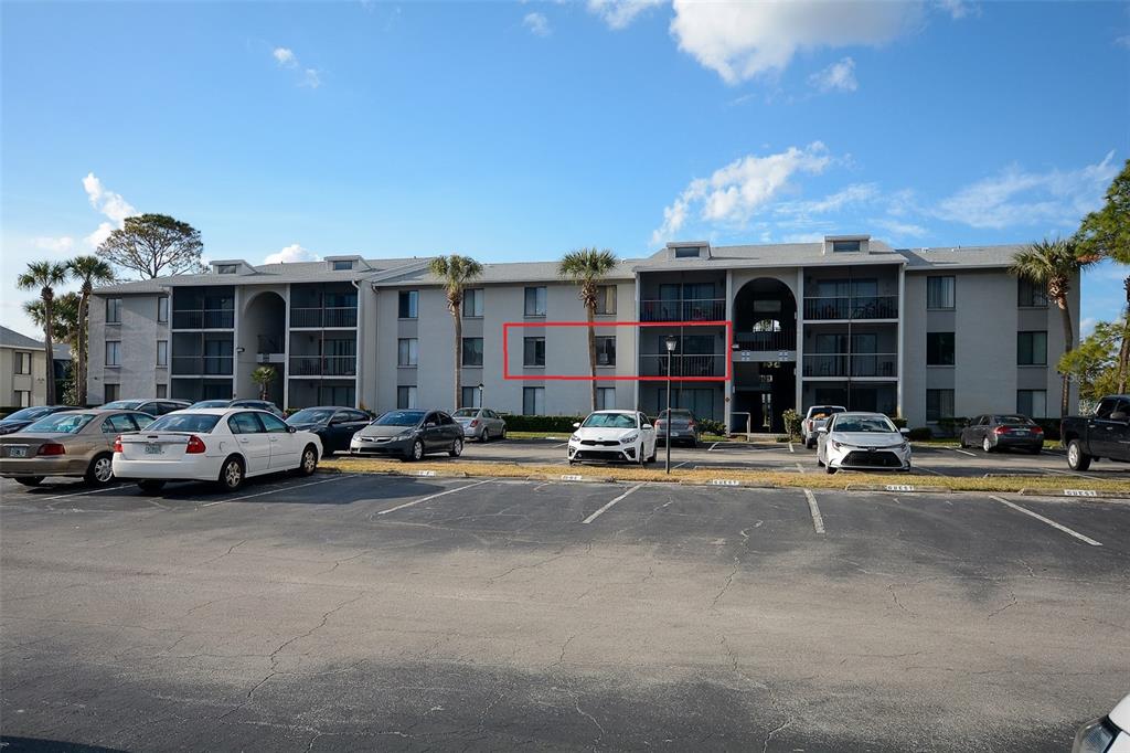 1623 South Pine Ridge Circle, Unit C2 Sanford, FL 32773 - Photo 1 of 1 a view of a car parked in front of a building