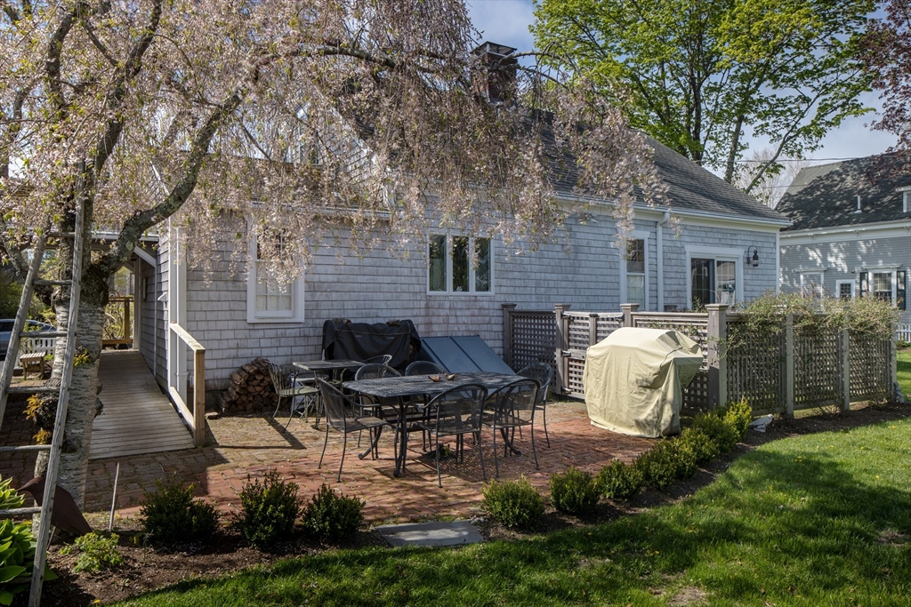 31 Main Street Marion, MA 02738 - Photo 9 of 29 a view of a house with backyard and sitting area