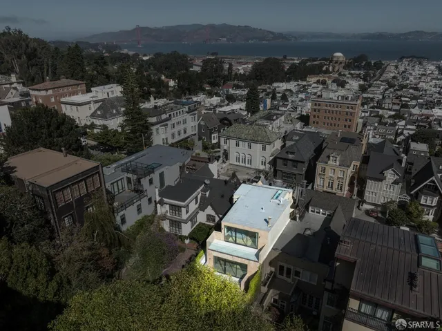 an aerial view of a house with a garden