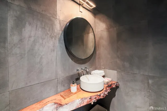 a bathroom with a sink and a mirror