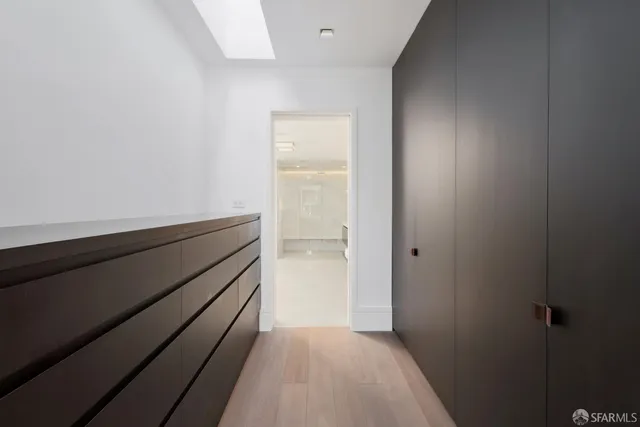 a view of room with wooden floor