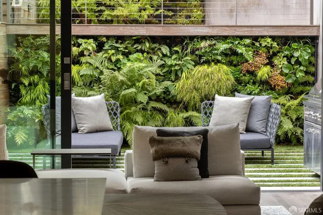 a view of outdoor space with seating area and green space