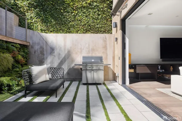 a balcony with table and chairs