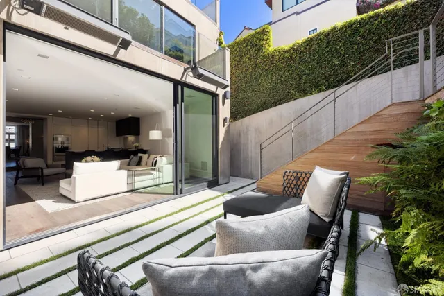 a outdoor living space with furniture and plants