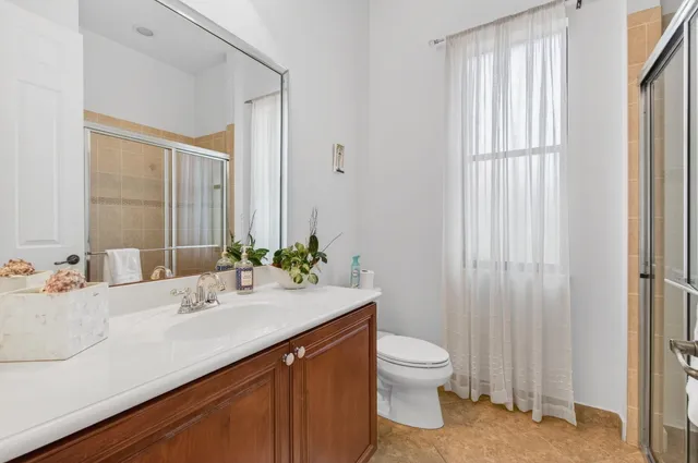 a large kitchen with granite countertop a stove and a refrigerator