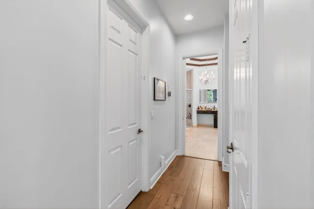 a living room with furniture a rug and a ceiling fan