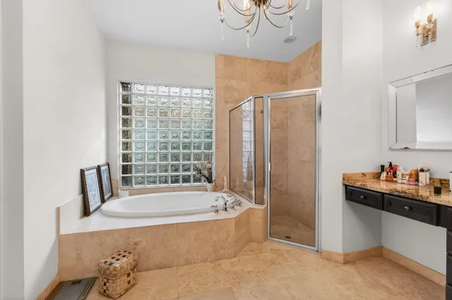 a kitchen with stainless steel appliances granite countertop a stove top oven a sink dishwasher and a refrigerator