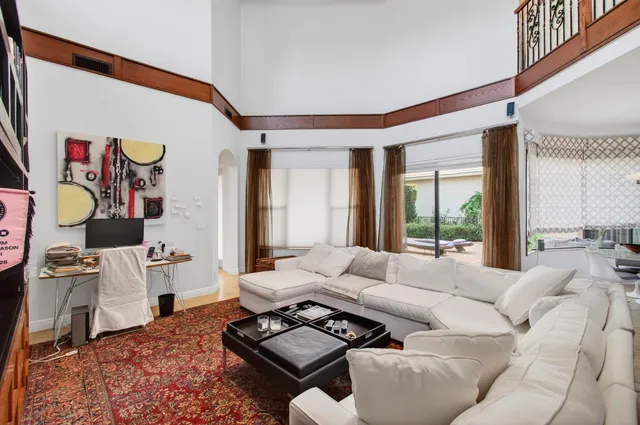 a view of a backyard with plants and entertaining space