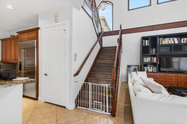 a living room with furniture a couch and a window