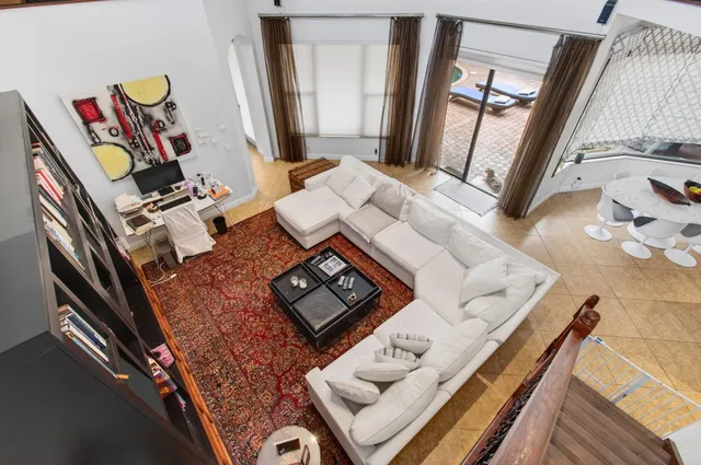 a living room with couches and a coffee table