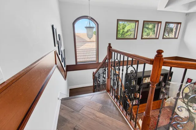 a living room with furniture and a dining table