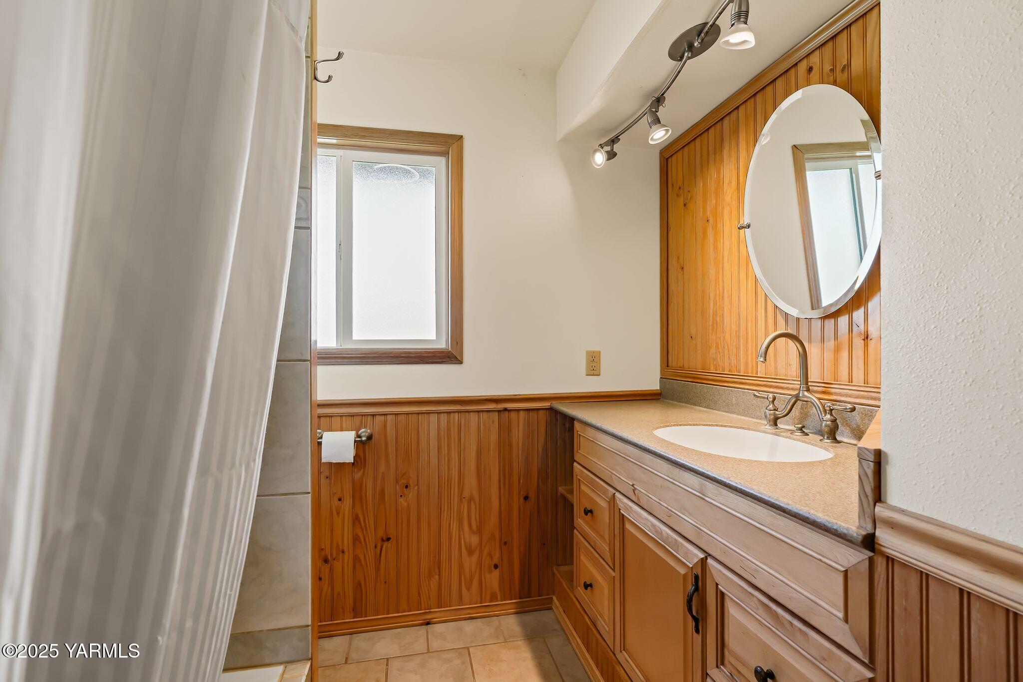 3090 Lombard Loop Road Wapato, WA 98951 - Photo 18 of 44 a bathroom with a sink and a mirror