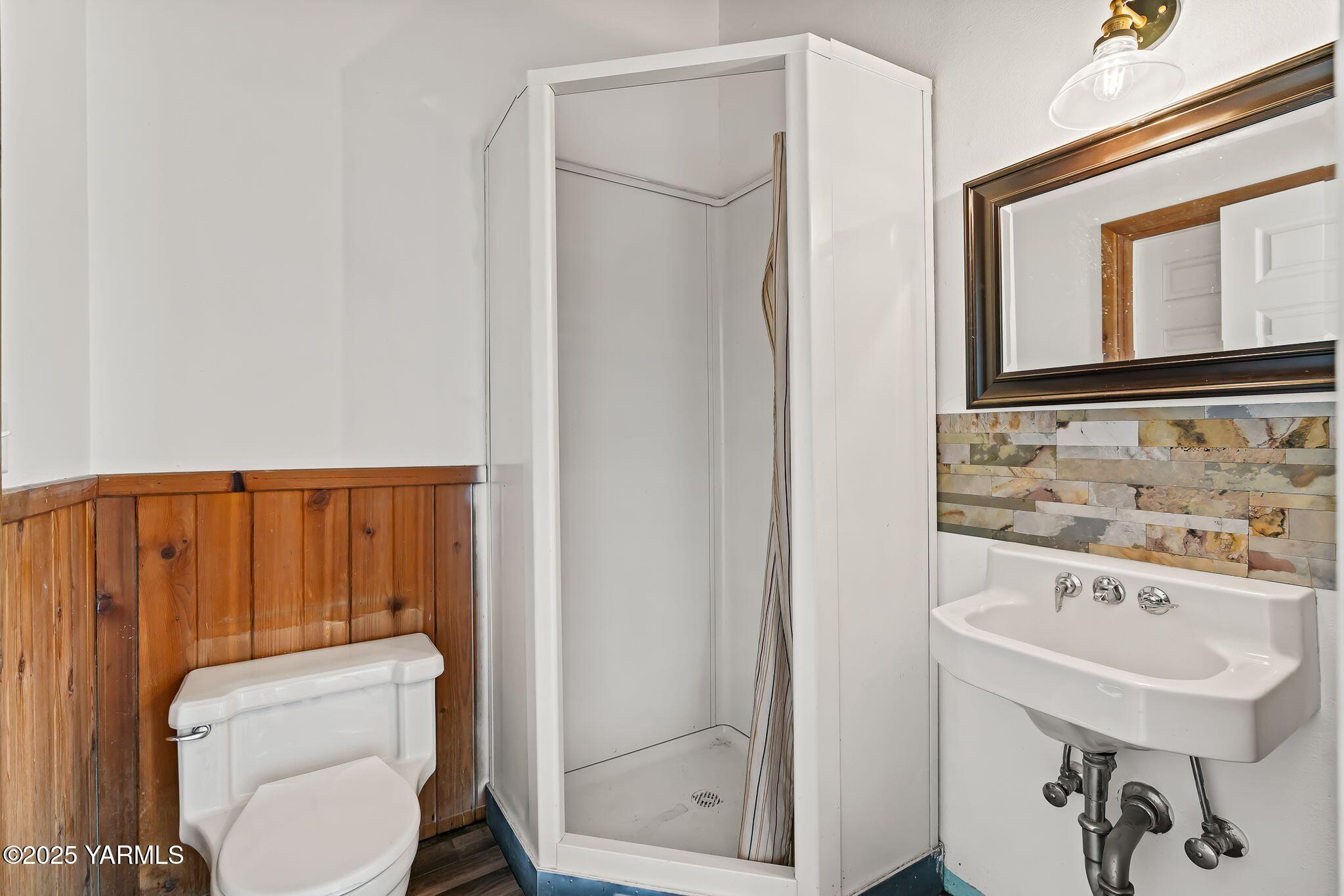 3090 Lombard Loop Road Wapato, WA 98951 - Photo 38 of 44 a bathroom with a sink a toilet and a mirror