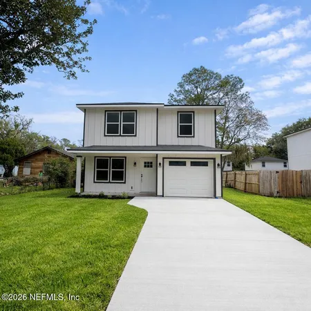 a front view of a house with yard