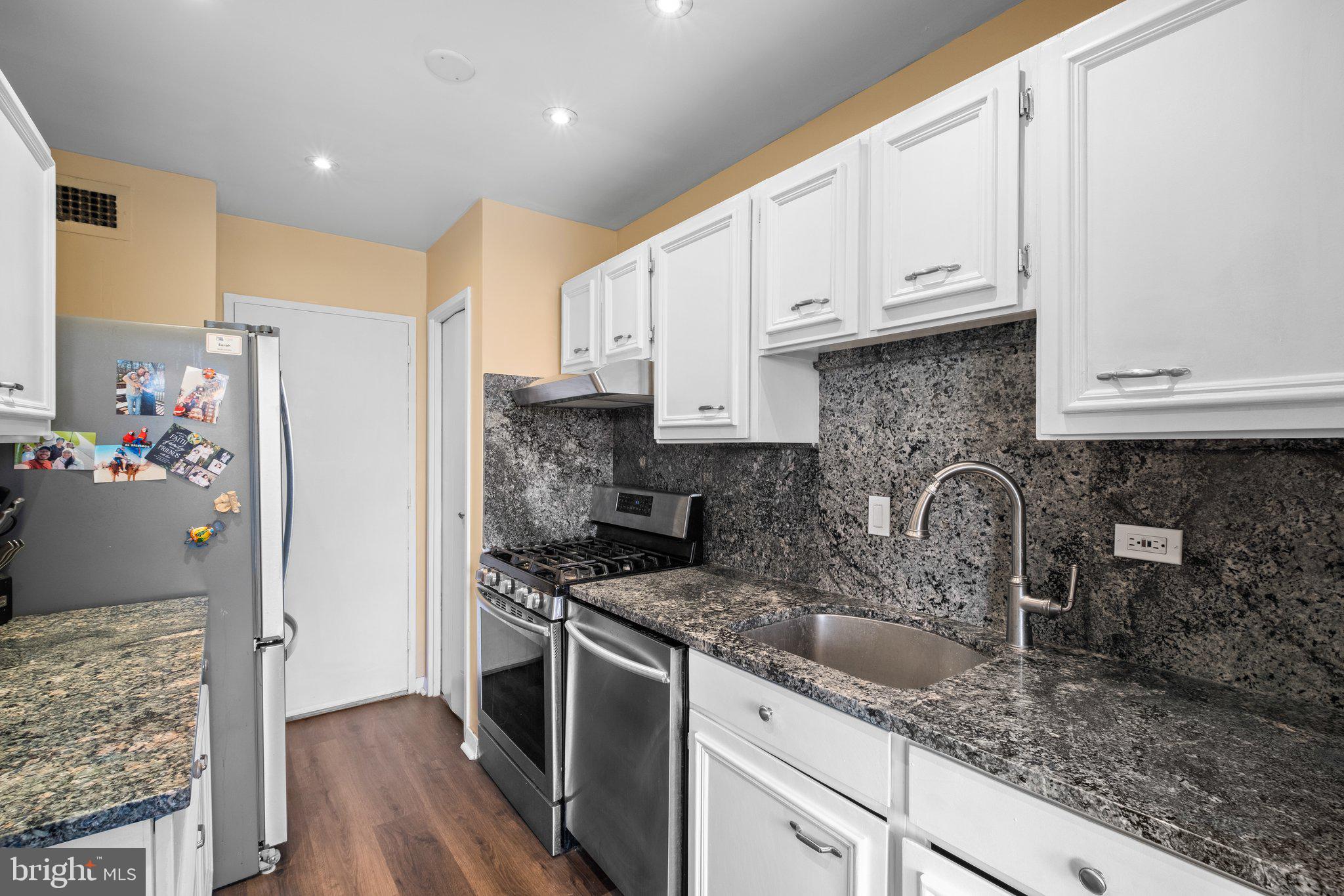 1900 Lyttonsville Road, Unit 1016 Silver Spring, MD 20910 - Photo 12 of 30 a kitchen with stainless steel appliances granite countertop a stove a sink and a refrigerator