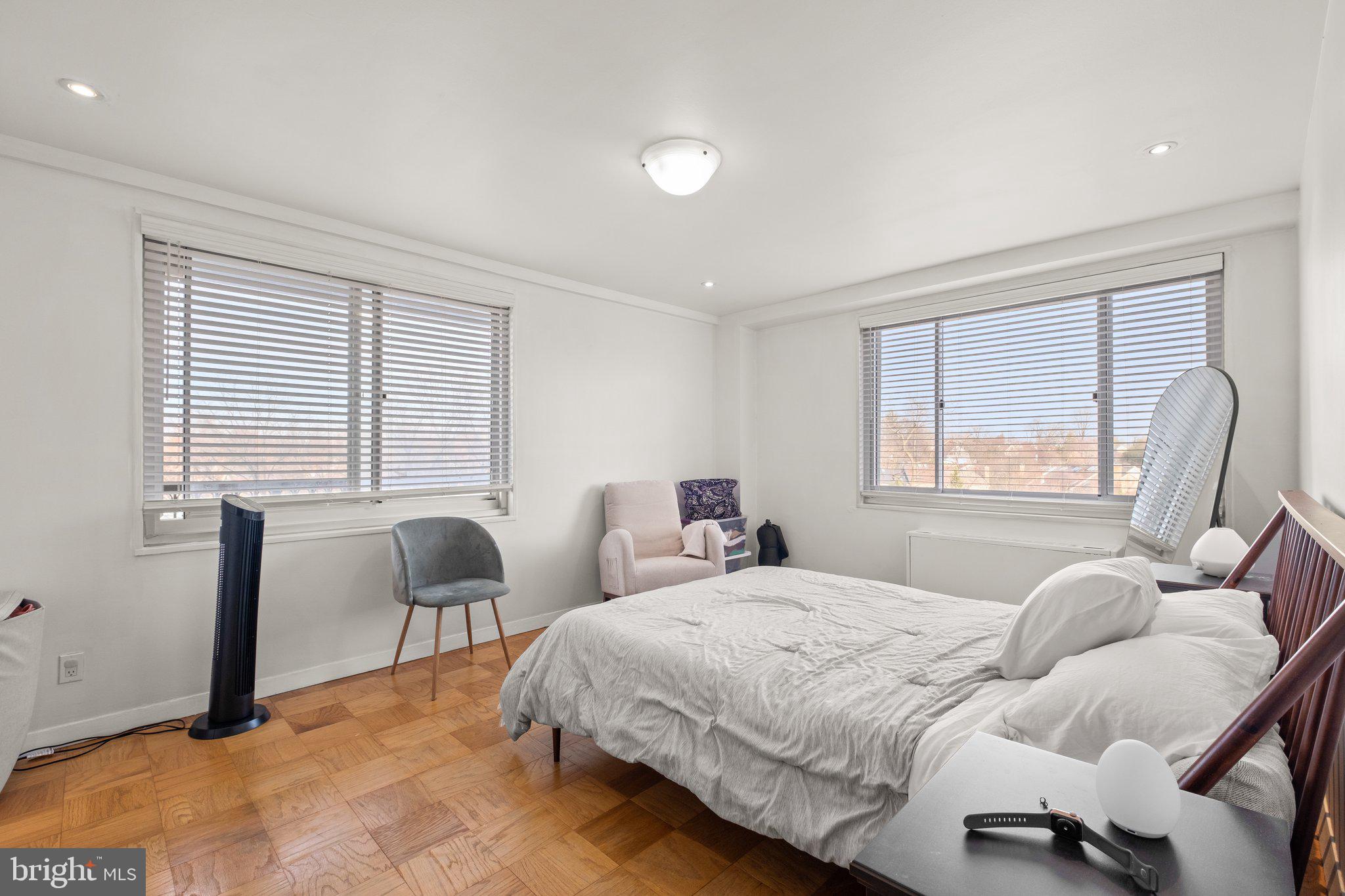1900 Lyttonsville Road, Unit 1016 Silver Spring, MD 20910 - Photo 18 of 30 a bedroom with bed and a large window