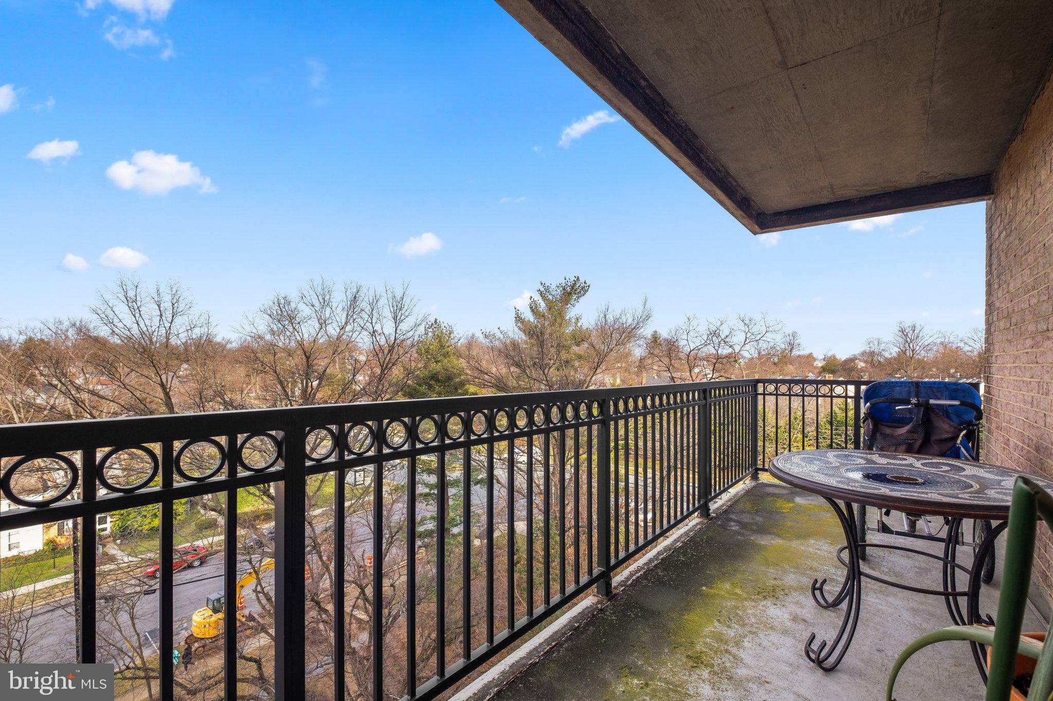 1900 Lyttonsville Road, Unit 1016 Silver Spring, MD 20910 - Photo 28 of 30 a view of a chairs and table in the balcony