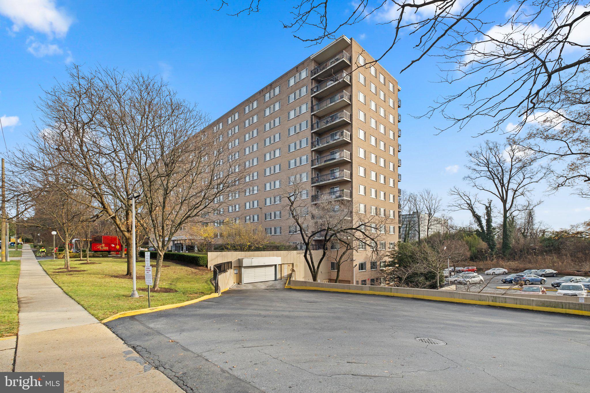 1900 Lyttonsville Road, Unit 1016 Silver Spring, MD 20910 - Photo 29 of 30 a front view of a building with trees