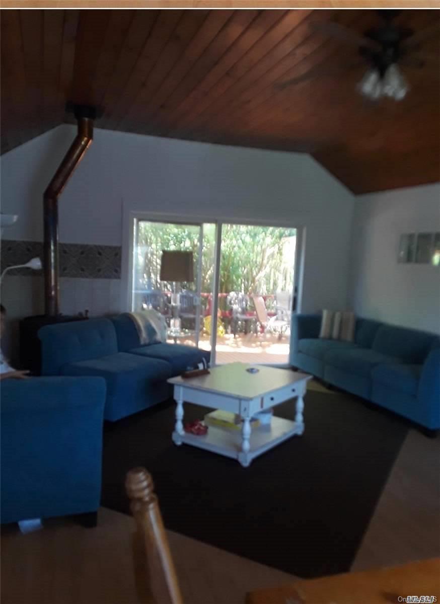 49 Surf Ocean Beach, NY 11770 - Photo 5 of 12 a living room with furniture