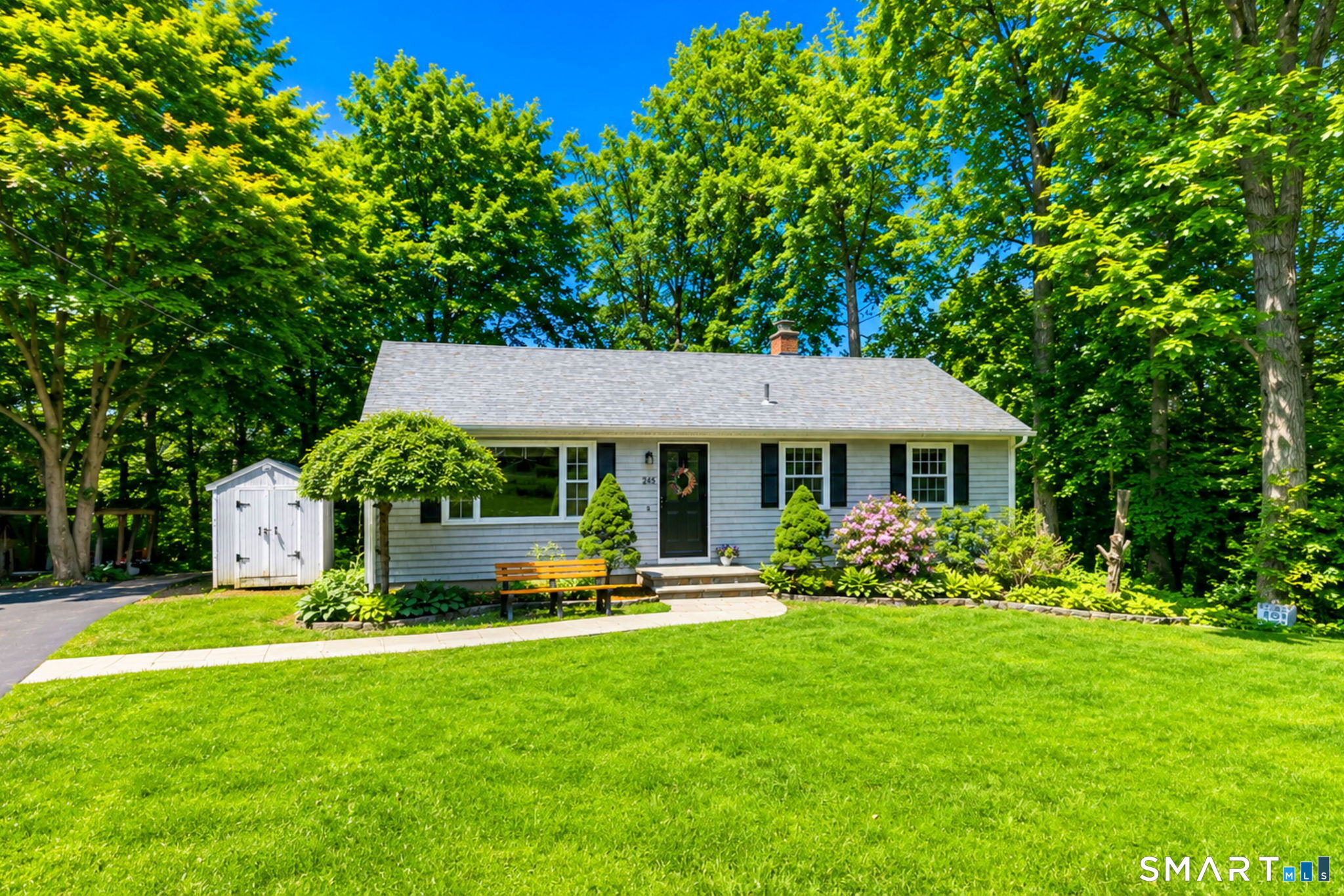 265 Shelter Rock Road Fairfield, CT 06825 - Photo 2 of 32 A perfect place to call home! A bluestone walkway and plantings lined with Belgium block leads you to the front door.
