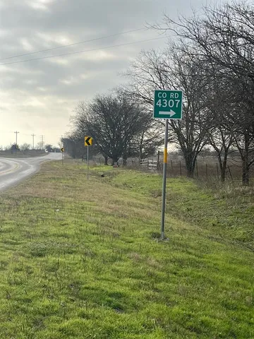 a view of a pool with a yard