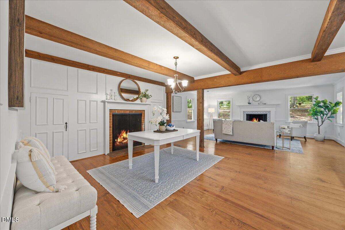 6516 Bakersfield Drive Raleigh, NC 27606 - Photo 6 of 59 a living room with furniture and a fireplace