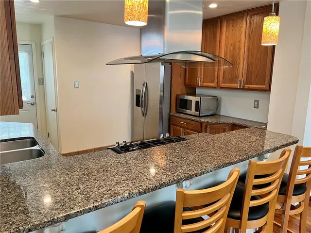 a view of a room with furniture and wooden floor
