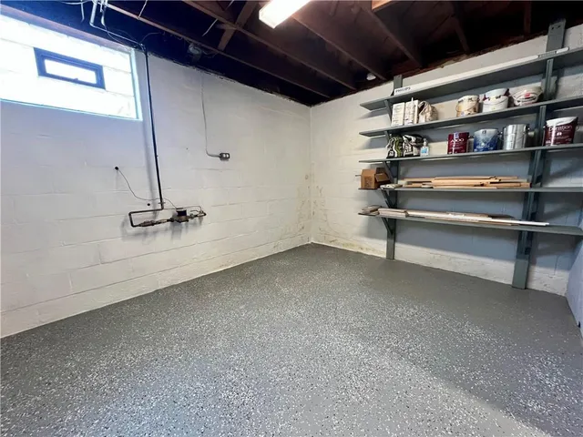 a view of an empty room with a fireplace