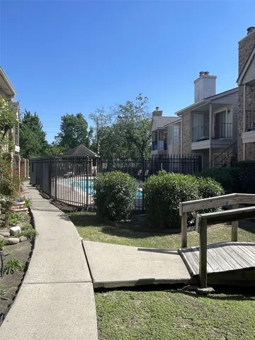 a view of house with outdoor space and sitting area